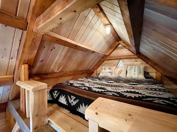 Tiny wooden cabin bedroom